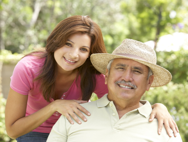 caregiver tapping the shoulder of patient